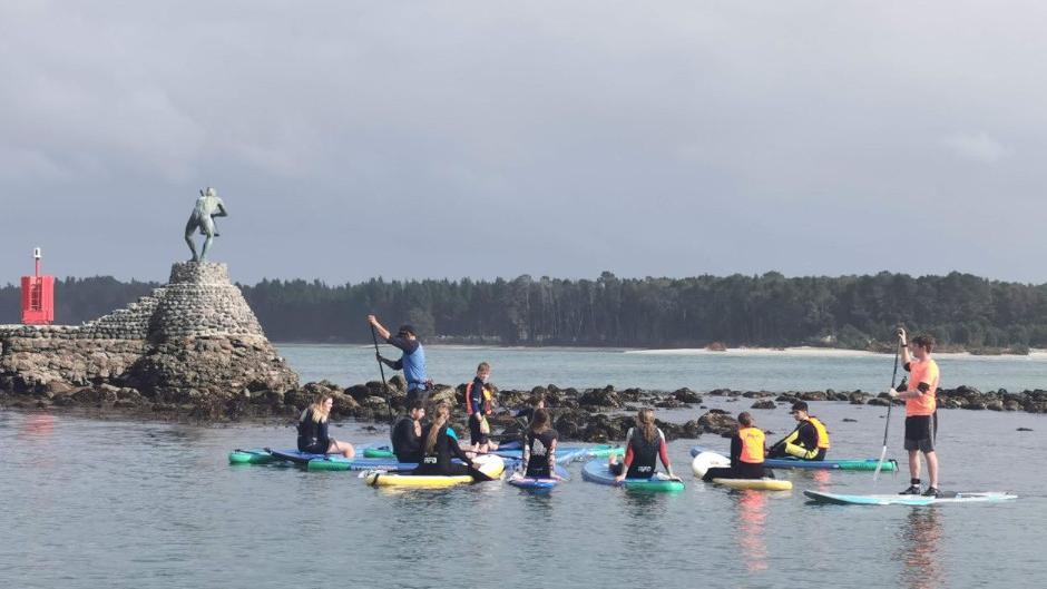 Embark on an unforgettable stand-up paddling adventure with our local Maori crew!