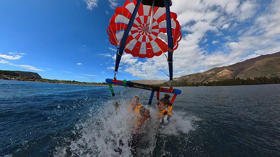 Join the friendly and experienced crew at Wanaka Parasailing for a truly memorable scenic parasail across Lake Wanaka or Lake Hawea.