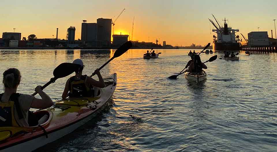 Kayaking is the perfect way to take in the sights of Melbourne City and what better time to do it than as the sun sets.