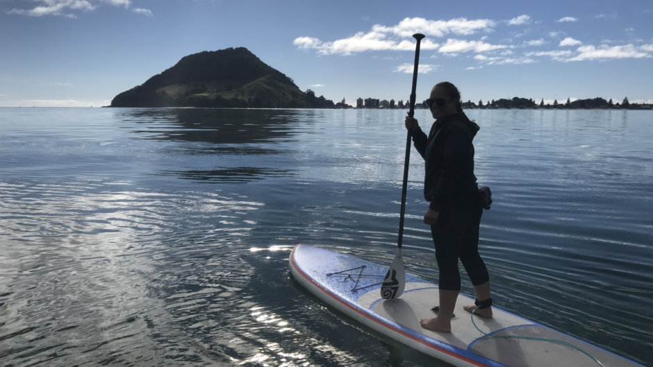 Master the art of paddleboard navigation and embark on a journey to explore the stunning waters of Pilot Bay with Mauao Adventures