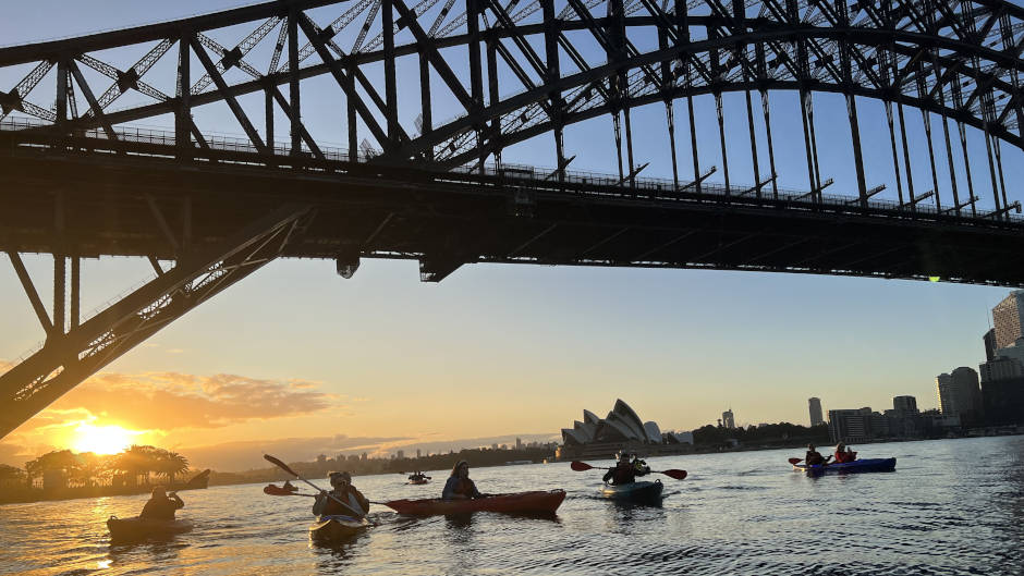 Spend your morning on a serene cruise watching the sun rise over the Harbour Bridge
