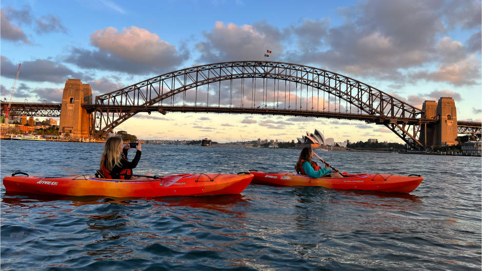 Watch the sunset over the Sydney Harbour as you paddle through the calm waters
