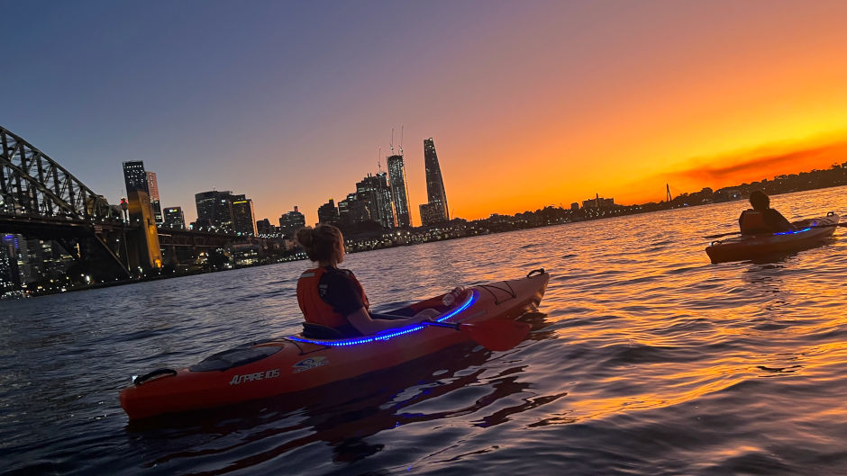 Watch the sunset over the Sydney Harbour as you paddle through the calm waters
