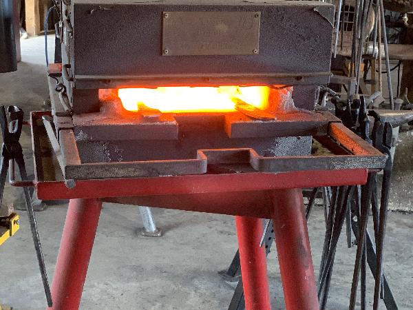 Heating the metal before working on it.