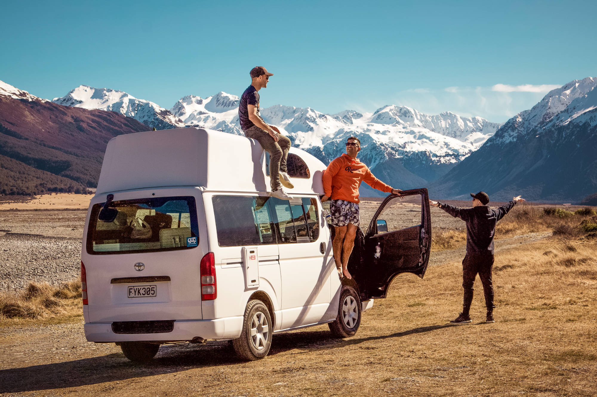 Campervan at a scenic New Zealand campsite.